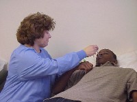 Ms. Cossette helps a student